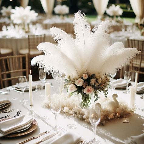 Feather Arrangements Wedding, Gatsby Wedding Table Decor, Floral Arrangements With Feathers, Wedding Table Decorations Feathers, Feathers And Candles Centerpieces, Feather Decoration Ideas, Wedding Centerpieces Feathers Flower, Feather Centerpieces Diy, White Feather Flower Arrangements