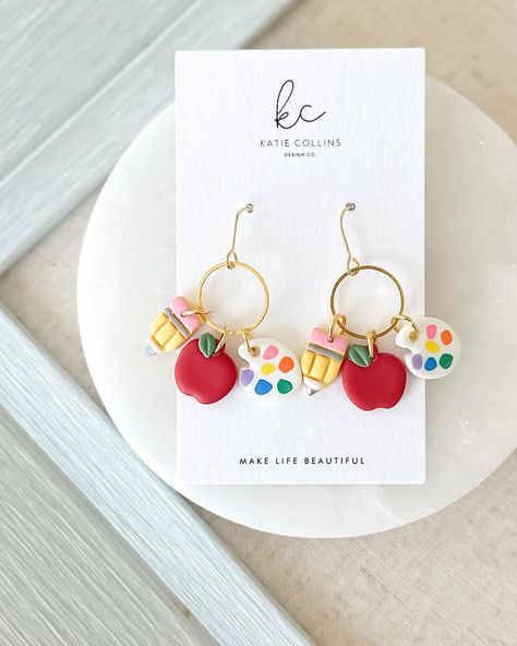 Classroom couture is available now 🍎 #teacher #teacherlife #teacherstyle #polymerclay #polymerclayearrings #etsyfinds #etsyseller Teacher Earrings Clay, Painted Pencils, Collins Design, Teacher Earrings, Paint Palettes, Favorite Teacher, Earring Cards, Polymer Clay Charms, School Time