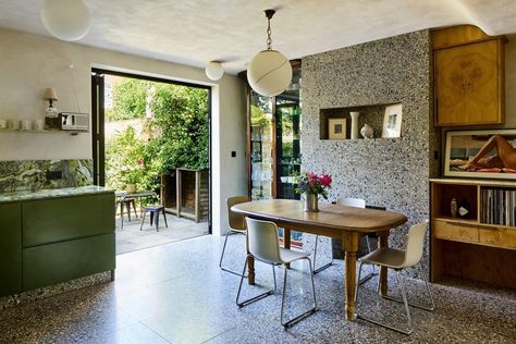 In the popular Dartmouth Park in London stands this recently renovated terraced house with unique interiors. The 1930s four-bedroom house has creative interiors featuring beautiful bespoke steel stained glass doors and terrazzo, as well as Terrazzo Kitchen, 1930s House Interior, Stained Glass Doors, Cottage Loft, Victorian Terraced House, Terrazzo Floor, Oak Wardrobe, Kentish Town, Airbnb Design