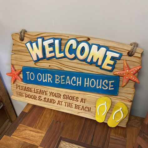 Hand Carved & Painted Beach House Sign - $185  A very cool Hand Carved & Painted Beach House Sign perfect for your bach or your garden. 560mm x 370mm (Wooden and hand painted). Beach Signs Wooden, Beach House Sign, Wooden Signage, Beach House Signs, Auckland Nz, Custom Signage, Beach Signs, Logo Sign, Us Beaches