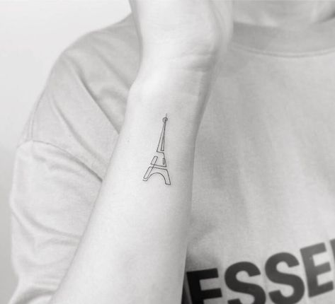 Single line Eiffel tower tattoo on the wrist Continuous Line Tattoos, Eiffel Tower Tattoo, Tower Tattoo, Tattoo On The Wrist, Continuous Line Tattoo, Mo Ganji, Paris Tattoo, Back Of Arm Tattoo, Single Line Tattoo