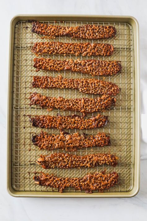 Praline Bacon | Looking for a show-stopping brunch recipe?  Look no further!  Here's the best blend of sweet, salty and slightly spicy, all wrapped up in everyone's favorite, bacon. Thick-cut bacon coated in a pecan-brown sugar crumble and roasted until sticky, caramelized and crisp.    #brunch #brunchrecipes #nevernothungry #bacon Praline Bacon Recipe, Praline Bacon, Not Hungry, Sugared Pecans, Thick Cut Bacon, Brunch Recipe, Toasted Pecans, Pork Sausage, Smoked Bacon