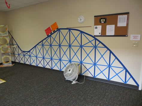 Roller coaster from painters tape on the wall.  Looked great, and was cheap and easy. Roller Coaster Decorations, Roller Coaster Party, Carnival Vbs, Amusement Park Party, Minion Party Theme, Resident Assistant Door Decs, Carnival Classroom, Roller Coaster Theme, Rock N Roller Coaster