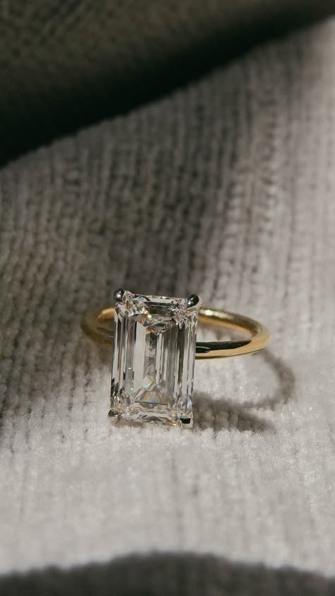 Know for its vibrant sparkle and clean lines, this beautiful emerald cut engagement ring is the perfect piece for someone who loves both glam and class. Emersld Cut Ring, Emerald Setting Engagement Ring, Emerald Engagement Ring 1 Carat, Simple Rectangle Engagement Rings, Emerald Shape Diamond Ring, 1 Ct Emerald Engagement Ring, Criss Cut Engagement Ring, Lab Grown Emerald Cut Engagement Ring, Emerald Cut Engagement Ring Unique