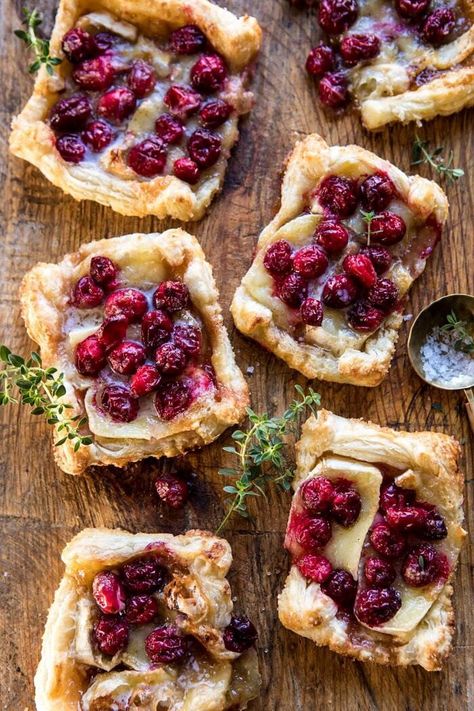 Cranberry Brie Pastry Tarts | halfbakedharvest.com #brie #cranberries #appetizers #thanksgiving #christmas Thanksgiving Food With A Twist, Thanksgiving Recipes With Cranberries, Thanksgiving Twist Recipes, Twist On Thanksgiving Recipes, Thanksgiving Potluck Appetizers, Non Traditional Thanksgiving Recipes, Thanksgiving With A Twist, Thanksgiving Recipes Non Traditional, Thanksgiving Creative Food