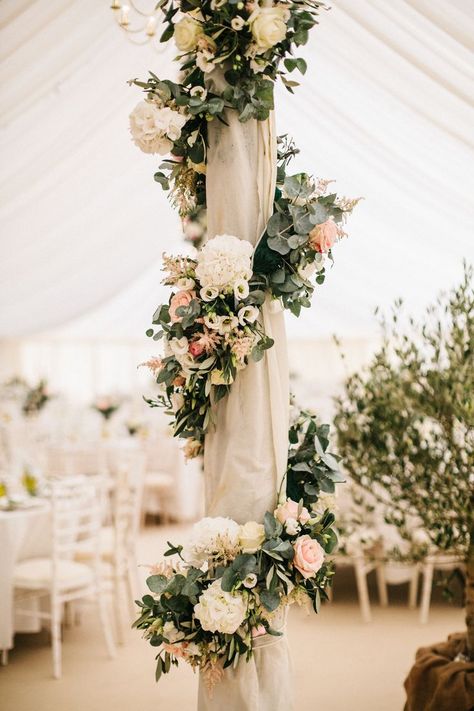 Marquee Poles With Floral Decor Boho Floral Wedding Decor & Bohemian Wedding Decorations - With beautiful peach soft blush pinks floral & elegant floral wreath! Perfect for Fall, Floral & Romantic Weddings! Wedding Pillars Decorations, Decorate Poles For Wedding, Decorating Poles For Wedding, How To Decorate Poles For Wedding, Post Wedding Party Decorations, Flowers On Poles Wedding, Decorate Columns For Wedding, How To Decorate Pillars For Wedding, How To Decorate Columns For Wedding