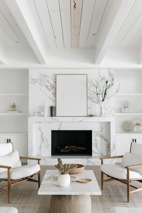 40 Beautiful Modern Mantel Decor Designs for a Whimsical Look Modern White Mantel Fireplace, Contemporary Fireplace Mantle Tile, Modern Fireplace White Tiles The Home Depot, Modern Marble Fireplace Mantle, Trendy Fireplace Ideas, Decor Next To Tv On Wall, Modern Marble Fireplace Corner, Modern Mantel Decor, Tv On Wall