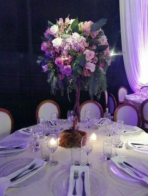 Enchanted Forest Centerpieces Purple, Purple Enchanted Forest Quinceanera, Lilac Enchanted Forest Quinceanera, Sweet 15 Centerpieces, Forest Centerpieces, Lavender Quinceanera Ideas, Garden Quince, Rapunzel Quinceanera Theme, Enchanted Forest Theme Quinceanera