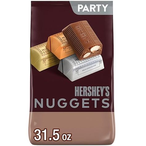 🎃 Contains one (1) 31.5 oz bulk party pack of HERSHEY'S NUGGETS Assorted Chocolate Halloween Candy
🧙‍♀️ Enchant monsters with HERSHEY'S chocolates for candy trays or spooky apple decorations
🕸️ Delicious chocolates wrapped in vibrant silver and gold foils for freshness and on-the-go snacking
🍁 Be the sweet treat champion for fall fun, back to school, Thanksgiving, and tailgating
🍬 Perfect for handing out Halloween chocolates to trick-or-treaters Stocking Stuffer Ideas For Men, Christmas Stocking Stuffer Ideas, Candy Assortment, Chocolate Halloween, Filled Candy, Individually Wrapped Candy, Hershey Nugget, Period Kit, Chocolate Wrapping