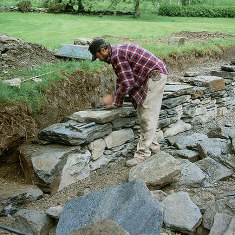 Build a Dry-Stacked Stone Retaining Wall - FineGardening Build A Rock Wall, Steel Retaining Wall, Building A Stone Wall, Rock Retaining Wall, Stone Walls Garden, Dry Stack Stone, Stacked Stone Walls, Garden Retaining Wall, Stone Retaining Wall