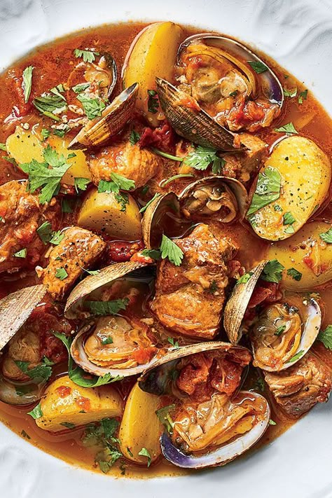 This Portuguese braised pork and clam recipe incorporates pork shoulders, garlic, white wine, onions, potatoes, clams, cilantro, lemon and crusty bread to create the ultimate comfort food meets seafood recipe.#comfortfood #seafoodrecipes #clamrecipes #porkrecipes #portugueserecipes Clams Recipe, Pork Shoulder Recipes, Boneless Pork Shoulder, Clam Recipes, Braised Pork, Pork Shoulder, Portuguese Recipes, Pork Dishes, Stew Recipes