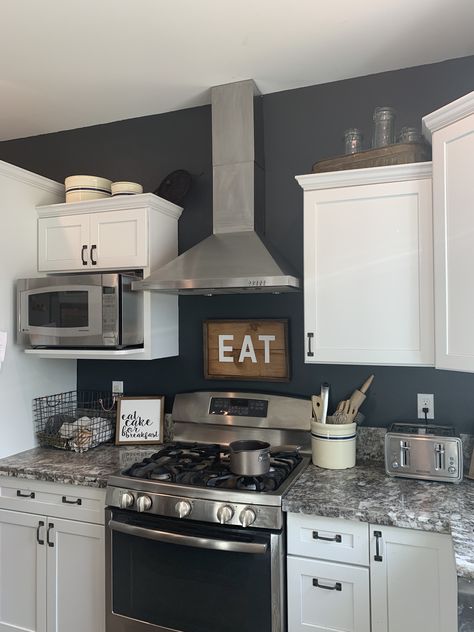 “Satin Black”Behr paint in Marquee. Satin finish. Kitchen Black Walls White Cabinets, Black Painted Kitchen Walls, Black Wall White Cabinets, Dark Walls In Kitchen, Behr Satin Black, Black Kitchen Accent Wall, Black Wall In Kitchen, Dark Grey Kitchen Walls, Black Behr Paint