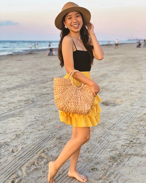 stylewithtiffanyd_ is wearing a black bodysuit, a mini skirt, straw hat and straw bag for a summer vacation outfits Yellow Mini Skirt, Don't Know What To Wear, Beach Vacation Outfits, Vacay Mode, Yellow Outfit, Outfits 2023, Beach Fashion, Vacation Outfits, Black Bodysuit