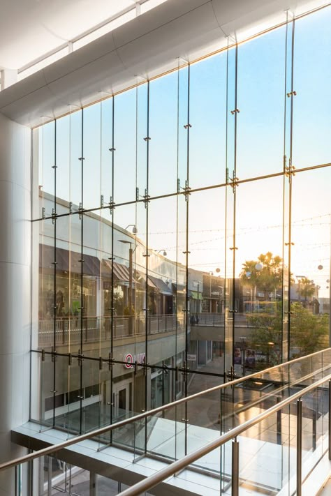 “Lifestyle” experience complete with natural light and free flowing space at Del Amo Fashion Center Mall, achieved thanks to Pilkington Planar™ structural glass fin wall - an intricate and sophisticated system of ultra-clear structural glass. | W&W Glass, LLC Glass Facade Detail, Exterior Glass Wall, Del Amo Fashion Center, Curtain Wall Detail, Glass Wall Systems, Canopy Glass, Glass Spider, Wood Facade, Architectural Materials