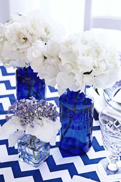 Cobalt Blue Wedding Centerpieces, Cobalt Blue Flowers, Blue Glass Wedding Centerpieces, Greek Style Party Decorations, Cobalt Blue Centerpieces, Talavera Wedding Decor Blue And White, Mama Mia Centerpieces, Blue And White Centerpieces For Party, Bright Blue Wedding Theme