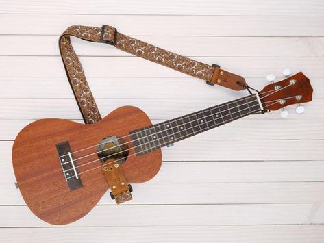 Are you ready to make sweet music? If you love playing the ukulele, you are sure to spend several hours at a time strumming away. However, trying to support your ukulele while you play can be uncomfortable at times, especially if you own a heavier model. Fortunately, you can easily solve this problem by investing … Top 7 Best Ukulele Straps in 2021 Reviews Read More » The post Top 7 Best Ukulele Straps in 2021 Reviews appeared first on Old-Time Music. Ukulele Sizes, Vintage Camera Strap, Cool Ukulele, Ukulele Straps, Tenor Ukulele, Guitar Ukulele, Alphabet Stamps, Camera Straps, Guitar Accessories