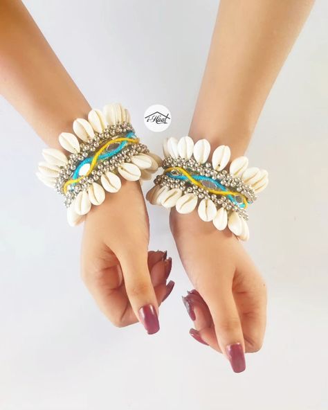 Are you planning your navratri look in advance? If yes we have got a perfect product for you❤️ Checkout these beautiful Multicolored Bangle set adorned with lots of Cowrie shells, ghungroo and mirrors 🔥 The bangles are available in all sizes and can be customised in any color to match your Garba Vibes for this Navratri Season 🔥 Visit indiashaat.com for more handmade jewellery options #indiashaat #navratrijewellery #bohojewellery #bangles #dekhatenu [Handmade jewellery, navratri jewe... Bollywood Style Bangle For Navratri Celebration, Bollywood Ceremonial Bangle For Navratri, Traditional Bangle For Navratri Festival, Handmade Bollywood Bangle For Navratri, Navratri Cutdana Bangle Jewelry, Navratri Look, Bangles Set, Cowrie Shells, The Bangles