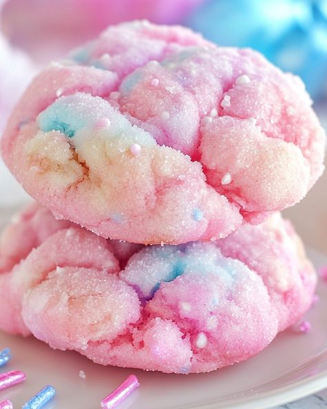 Cotton Candy Cookies 🍬🍪 Ingredients: - 2 1/2 cups all-purpose flour - 1/2 tsp baking soda - 1/4 tsp salt - 1 cup unsalted butter, softened - 3/4 cup granulated sugar - 1/2 cup powdered sugar - 1 large egg - 2 tsp vanilla extract - 1/2 tsp cotton candy flavoring - Pink and blue food coloring - Cotton candy (optional, for garnish) Instructions: 1. Preheat oven to 350°F and line baking sheets with parchment paper. 2. In a bowl, whisk together flour, baking soda, and salt. 3. In another bowl,... Cotton Candy Cups, Pink And Blue Food, Cotton Candy Aesthetic, Cloud Dessert, Cute Cotton Candy, Disney Inspired Nursery, Cotton Candy Cookies, Cotton Candy Flavoring, Candy Cup