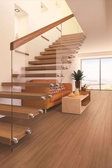 Floating floorboards installed in a living area, also featuring large sliding glass doors and a modern staircase. Floating Floorboards, Floor Boards, Blue Space, Engineered Flooring, Timber Flooring, Tongue And Groove, Small Room, Coastal Homes, Stylish Home