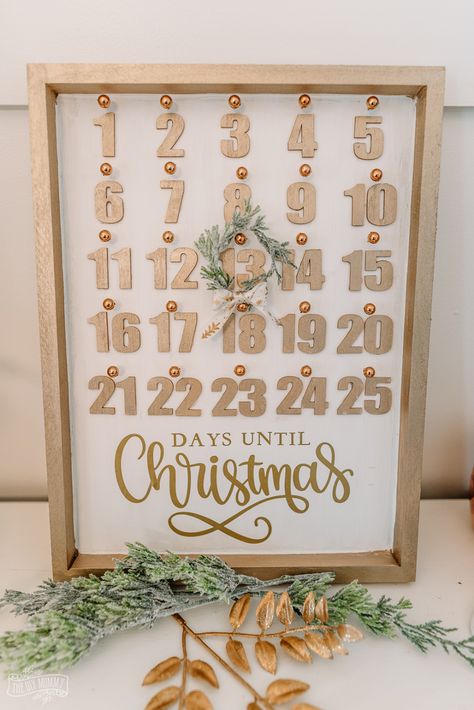 Learn how to make a beautiful DIY Christmas countdown calendar with dollar store supplies Diy Countdown To Christmas, Diy Christmas Countdown Calendar, Diy Countdown, Diy Christmas Countdown, Diy Snowman Decorations, Christmas Countdown Diy, Dollar Store Christmas Decor, Diy Mommy, Eid Decor