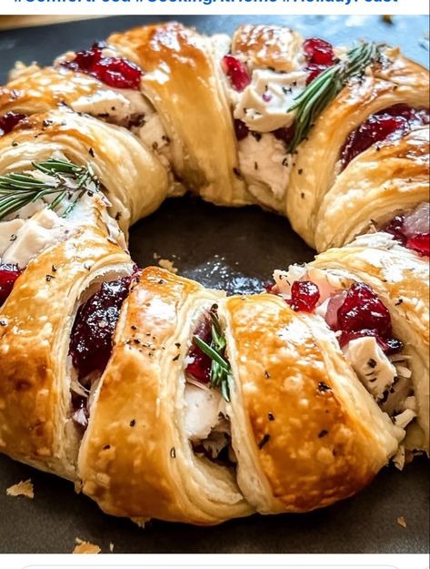 1 tube crescent rolls
4 oz chive and onion cream cheese
1 1/2 tbsp Dijon mustard
3 tsp finely chopped fresh rosemary or thyme, divided
2 cups shredded Gruyere cheese, divided
1 lb thinly sliced turkey
1 (14 oz) can whole berry cranberry sauce
2 tbsp butter, melted
1/2 tsp poppy seeds
1/2 tsp granulated garlic
1/4 tsp salt

Preheat oven to 375°F Line a large baking sheet with parchment paper

Separate crescent rolls widest portion inside and edges overlapping.

Filling: whisk cream cheese, Dijon mustard, and 1 tsp of rosemary or thyme. Spread Sprinkle with 1 cup of shredded cheese.
Arrange turkey slices over cheese, Spread half cranberry sauce over turkey and top with remaining cheese.

mix together melted butter, poppy seeds, garlic, and salt. 

Bake for 22-24 minutes until golden. Savory Turkey & Cranberry Crescent Ring, Savory Turkey And Cranberry Crescent, Turkey Crescent Rolls, Savory Turkey And Cranberry Crescent Ring, Savory Turkey And Cranberry Ring, Thanksgiving Crescent Ring, Turkey And Cranberry Crescent Ring, Crescent Roll Recipes Thanksgiving, Cresent Rings Recipes Dinners