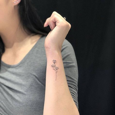 Flower On Side Of Wrist, Tiny Sweet Pea Tattoo, 3 Small Flowers Tattoo, April Sweet Pea Tattoo, Wrist Tattoos For Women Flower, Tattoo Outer Wrist, Tattoo Flower Wrist, Small Forearm Tattoos For Women, Dainty Wrist Tattoo