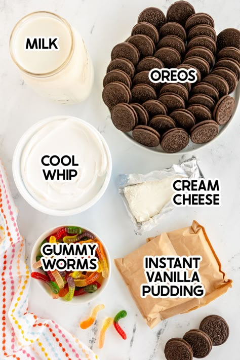 Fun Oreo dirt cups that are super simple to make and the perfect way to enjoy dirt and worms! Worms N Dirt Dessert, Pudding Worms And Dirt, Graveyard Oreo Dirt Cake, Dirt Pudding Recipe With Cream Cheese, Oreo Worm Dirt Cake, Easy Dirt Cup Recipe, Dirt Pie Cups, Homemade Dirt Cups, Simple Dirt Cake