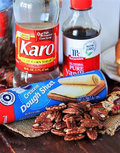 Crescent Pecan Pie Squares Ingredients Image Crescent Roll Pecan Pie Bars, Pecan Pie Bars Crescent Rolls, Pecan Bars With Crescent Rolls, Pecan Pie Bars With Crescent Rolls, Pecan Crescent Cookies, Crescent Dough Sheet Recipes Desserts, Recipe Using Crescent Dough Sheet, Pecan Kringle Recipe, Pecan Pie Bars With Store Bought Crust