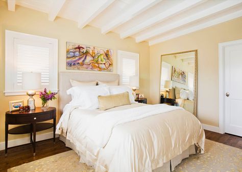 Bedroom With Beige Walls Light Yellow Bedrooms, Bedroom Wall Paint Colors, Light Yellow Walls, Yellow Bedroom Walls, Cottage Traditional, Dark Wood Bedroom Furniture, Dark Wood Bedroom, Tan Walls, White Bed Set