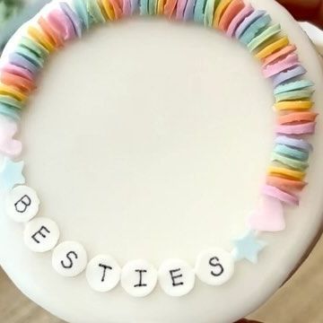 Jenny on Instagram: "💕friendship bracelet cookie! With a 3d printed stencil, the “beads” were thick enough to make them look more like the real beads so it worked out really well! ♡ Someone requested a stencil for semi circles so they could make sprinkles to look like little clay beads and I thought it sounded sooo cute so I wanted to test it out on a cookie! I’m obsessed 😍😍 I’ve been loving all the bracelet cookies everyone’s been doing bc I used to make these bracelets so much growing up 😆💓 The STL files for the sprinkle stencils are in my Etsy! I used the Semi circle, star, heart, and circle (the bigger one) for the beads ☺️ #sugarcookies #cookiedecorating #customcookies #sprinkles #stencil #sprinklestencil #baking #valentinesday #cookies" Friendship Bracelet Cupcake Cake, Friendship Bracelet Sugar Cookies, Friendship Bracelet Birthday Cake, Customized Round Beads Friendship Bracelets For Birthday, Friendship Bracelet Cookies, Friendship Bracelet Cake, Friendship Bracelet Cupcakes, Friendship Bracelet Birthday Party, Swiftie Cookies