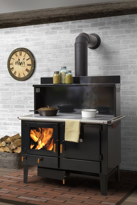 The Obadiah Wood Cook Stove is handmade in Lancaster County, Pennsylvania, and is “built for functionality, at a no-frills price,” the company says. The glass firebox door provides a view of the fire, and the oven door is available in a glass option. Prices start at $2,750. (Also see Obadiah’s exhaustive range of wood-burning cookstoves here.) Wood Burning Cook Stove, Stoves For Sale, Wood Fired Cooking, Wood Stove Cooking, Kitchen Queen, Homesteading Ideas, Wood Stove Fireplace, Cooking Stove, Fire Cooking