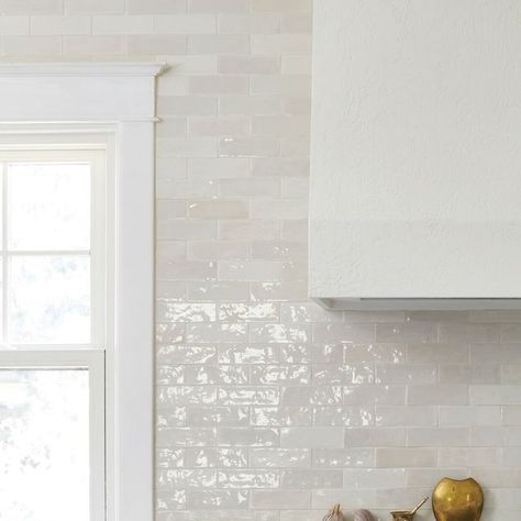 Parris McKenna on Instagram: "One of our favourite ways to create depth and dimension while using a monochromatic palette is to layer in textures, just like we did in this beautiful Burlington kitchen. We did a plaster finish on the range hood and used beautifully textured Zellige tiles for the backsplash, creating warmth and visual interest while working with a tone on tone palette ✨ . . . . #interiordesign #design #interior #homedecor #architecture #home #decor #interiors #homedesign #art #interiordesigner #furniture #decoration #interiordecor #interiorstyling #luxury #designer #handmade #homesweethome #inspiration #livingroom #furnituredesign #realestate #instagood #style #kitchendesign #architect #designinspiration #interiordecorating #vintage" Plaster Backsplash Kitchen, Plaster Hood Zellige Tile, White Handmade Tile Backsplash, Snow White Zellige Tile Bathroom, Snow White Zellige Tile, Riad Tile Snow White Zellige, Zellige Tile Kitchen, Plaster Finish, Zellige Tiles