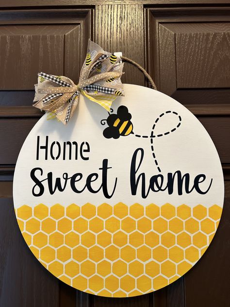 Circle wood BEE door sign perfect for gift for your favorite friend, family, and BEE lover!  These are perfect for office doors, wall decor, front doors and more!  Each 15 inch circle wood sign is made from birch wood 1/4inch thickness. Sign is painted with permanent vinyl as pictured.  Each sign will come with jute hanger and a matching bow( some bows may differ than shown due to in stock materials but will still look great!) Bee Door Hanger, Office Doors, Wood Bees, Handmade Door, Bee Sign, Honey Bee Decor, Wood Front Doors, Marble Dining Table, Hanger Home