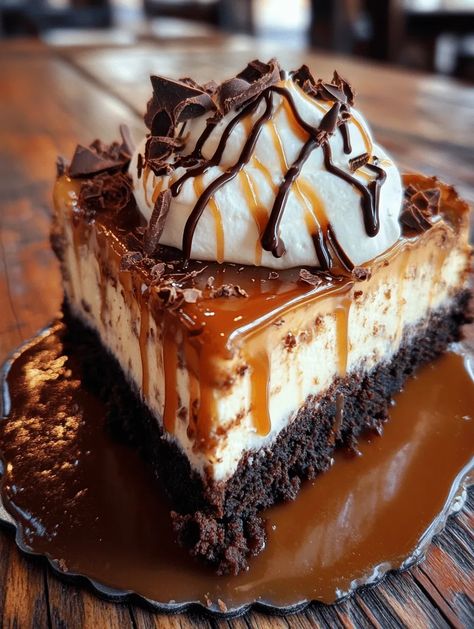 Imagine a dessert that brings together the satisfying chewiness of a brownie, the creamy richness of cheesecake, and the sweet allure of caramel – that's exactly what you'll experience with this Caramel Brownie Cheesecake Delight! Perfect for special occasions, this dessert delights everyone with its beautiful layered presentation and is guaranteed to satisfy your sweet tooth. Whether you’re ce... Caramel Brownie Cheesecake, Brownie Cheesecake Recipe, Brownie Bottom Cheesecake, Brownie Caramel, Cheesecake Delight, Brownie Trifle, Brownie Cheesecake, Caramel Brownies, Caramel Cheesecake