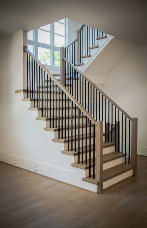 A modern railing can increase the visual appeal of your stairs and potentially the value of your home. Learn about our modern railing design process. Black Stair Railing, Case Minecraft, Indoor Railing, Metal Stair Railing, Metal Balusters, Interior Stair Railing, Wrought Iron Stair Railing, Modern Railing, Modern Stair Railing