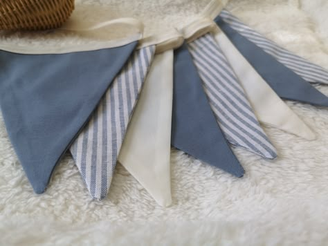 Blue Linen Striped Bunting Garland.   ✔ Each flag is double sided and measures 11cm x 11cm and there is 4 cm spacing between each flag and 25 cm ribbon at the end for tying.  ✔ Colors/ Material : Linen Blue stripes, cotton blue gray, cotton Ivory ✔ Measurements approx : 4 Flags - 75 cm - 2,4 Feets 8 Flags - 150 cm - 4,9 Feets 16 Flags - 300 cm - 9,8 Feets ✔ Other colors are available on request, here is the listing to buy: https://www.etsy.com/ca/listing/1058155494/custom-personalized-fabric-bun Baby Boy Sprinkle Decorations, Navy Blue Baby Shower Ideas Boys, Baby Boy Shower Decor, Baby Shower Decorations Boy, Nautical Baby Shower Boy, Boy Playroom, Banner Nursery, Blue Nursery Boy, Boy Baby Shower Decor