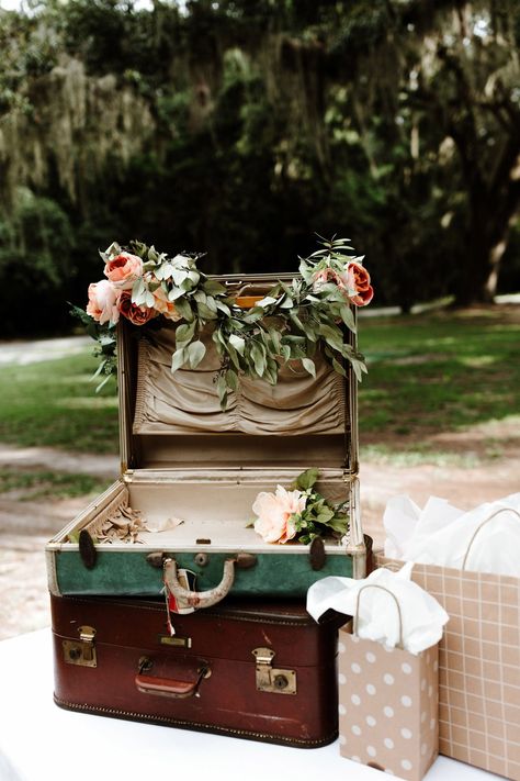 Ask guests to place their presents in vintage suitcases for a retro- or travel-inspired wedding. These ones were decorated with Edward on Saint Simons flowers. Wedding Gift Table Ideas, Gift Table Ideas, Wedding Seating Display, Vintage Suitcase Wedding, Creative Wedding Sign, Travel Inspired Wedding, Wedding Table Themes, Gift Table Wedding, Wedding Favor Table