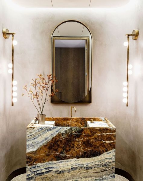 Mar 21, 2021 - If you think it's impossible to make a design statement in a small bathroom, think again. See how bold wallpaper, mirrors, and more﻿ can showcase the beauty of a small bathroom. Brass Tube, Powder Room Design, Brass Glass, Entry Foyer, Elle Decor, Glass Lighting, 인테리어 디자인, Edison Light Bulbs, Powder Room