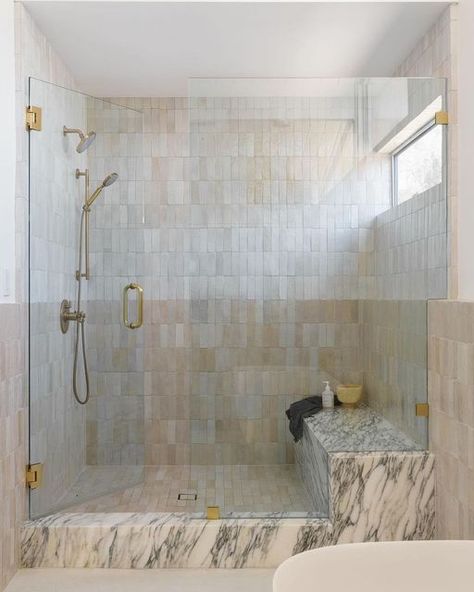 Zia Tile on Instagram: "Pure White or Casablanca? Why not both? Designer @anaberdesign stacked our two iconic zellige neutrals one over the other in this strikingly soft, two-toned shower. 📸 by @charlotteleaphotography" Zellige And Marble Bathroom, Zellige And Marble, Showers With Benches, Zellige Bathroom, Modern Primary Bathroom, Zellige Tile Bathroom, Walk In Shower With Bench, Glass Shower Wall, Zia Tile