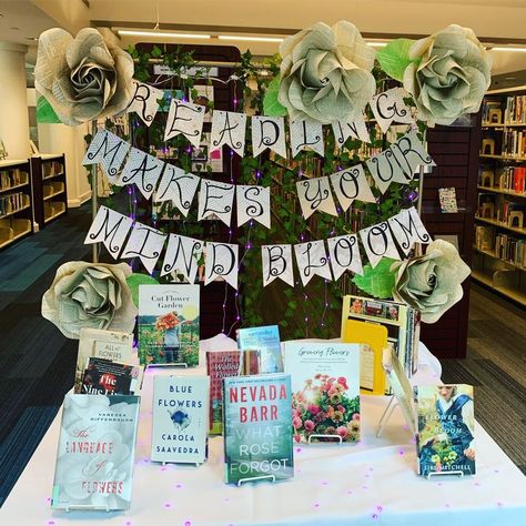 Spring library display "reading makes your mind bloom" May Book Displays, Spring Library, Read Grow Inspire Book Week, Spring Book Display, Reading Makes Your Mind Bloom, March Book Displays, Spring Library Displays, Spring Library Bulletin Boards, Library Spring Displays