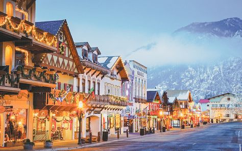 10 Adorable Mountain Towns That'll Make You Actually Enjoy Winter Leavenworth Washington Christmas, Leavenworth Christmas, Best Winter Vacations, Leavenworth Washington, Vacations In The Us, European Village, House Tree, Enjoy Winter, Vacation Usa