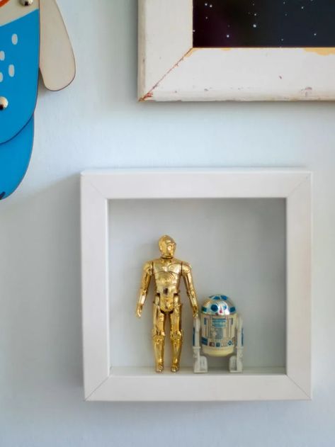 7 Fresh Art Displaying Ideas From This Week’s Top Tours | Apartment Therapy Star Wars Inspired Decor, Star Wars Shadow Box Ideas, Star Wars Wall Art Diy, Star Wars Framed Art, Figurine Display Ideas, Star Wars Living Room, Star Wars Zimmer, Star Wars Wall Decor, Star Wars Bathroom