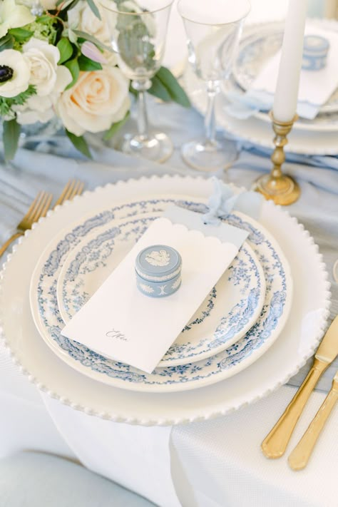 A close up of the blue Wedgwood trinket box fine art wedding favours resting upon the menu at each guest's place setting. | Planner: @bygraceweddings | Photography: @desireeanorth Wedding Favors At Place Setting, Wedgwood Blue Wedding, Wedding Table Wear, Name Place Settings Wedding, Unique Place Settings, Blue And White Place Settings, Place Setting Ideas Wedding, Chinoiserie Table Setting, Blue Wedding Place Settings