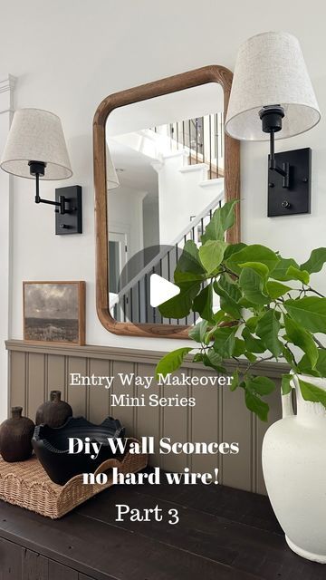 Sarah // DIY, design, & decor on Instagram: "DIY no hard wire Wall Sconces! Day 3 of my 4 part mini series for our entry makeover.  This is such an easy and affordable DIY to do!  ✨buy some wall sconces ( I got these for a crazy deal , 2 together for under $50 ) ✨ take the mounting plate off the light  ✨apply some @scotch wall mounting double sided tape!  ( note that most likely the screw top will stick out past the thickness of the tape- just double up on the tape to make sure it’s flush!) ✨mark out where you are mounting the lights on the wall and stick the mounting plate to the wall ✨ make sure it is level and push on it to make sure it really adheres! ✨pop on the base of the light on the screws and tighten it up ✨add in wireless remote control light bulbs 💡 these ones I grabbed have 3 Lights On The Wall, Diy Wall Sconces, Entry Makeover, Hallway Sconces, Entryway Inspo, Lights Around Mirror, Narrow Entryway, Wall Sconces Living Room, Sconces Living Room