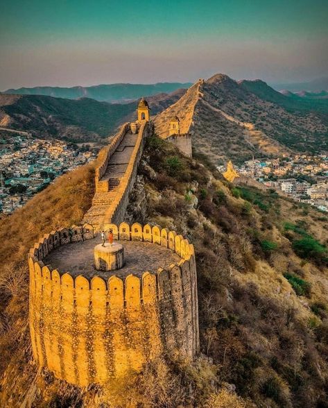 Nahargarh Fort, Jaipur, Rajasthan. Nahargarh Fort stands on the edge of the Aravalli Hills, overlooking the city of Jaipur in the Indian state of Rajasthan. Along with Amer Fort and Jaigarh Fort, Nahargarh once formed a strong defence ring for the city. The fort was originally named Sudarshangarh, but it became known as Nahargarh, which means 'abode of tigers'. The popular belief is that Nahar here stands for Nahar Singh Bhomia, whose spirit haunted the place and obstructed construction of the Rajasthan Fort, Nahargarh Fort Jaipur, Fort Photography, India Travel Photography, Rajasthan Travel, Jaipur Travel, Amer Fort, India Culture, Travel India