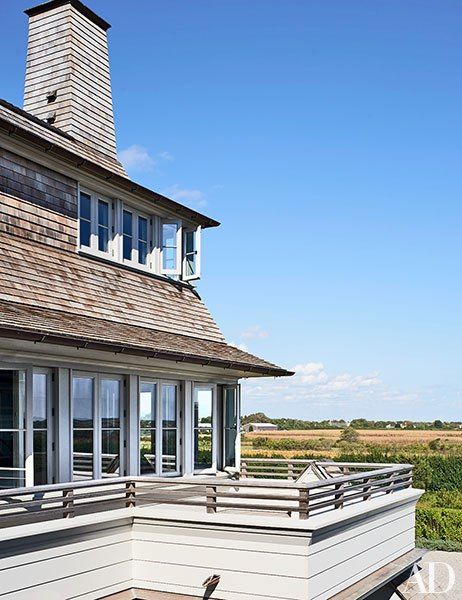 A second-story deck offers pastoral views. Long Island Beach, Terrace Fireplace, Maine Style, Shingle Style Architecture, Coastal Exterior, Island Beach House, High End Residential, Shingle Style Homes, Southampton New York