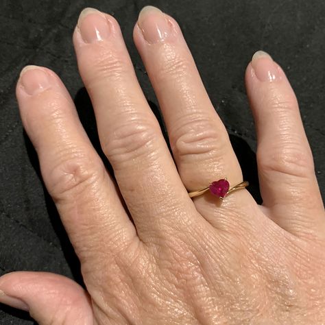 Celebrate Your Ruby Anniversary with a Bespoke Twist. 40 years of love deserve a celebration that's both timeless and unexpected. This captivating heart-shaped ruby solitaire ring embodies just that.  Set in a modern twisted 18k yellow gold band, it symbolises the enduring passion of the Ruby Anniversary with a touch of unexpected elegance, much like the journey you've shared.⁠ ⁠ #rubyversary #anniversarygift #rubyring #heartshape #18kyellowgold #bespokejewelry #rubyredpassion #40yearsoflove Ruby Anniversary Gifts, Ruby Heart Ring, Ruby Solitaire Ring, Ruby Anniversary, Gold Jewels Design, Ruby Heart, Ruby Engagement Ring, Twisted Band, Dress Rings