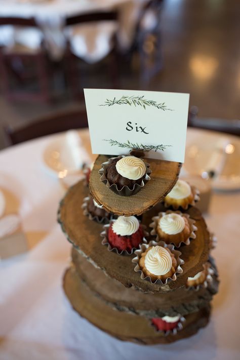 | wedding table centerpieces with treats | mini wedding bundt cakes | modern rustic wedding ideas | elegant wedding table numbers | DIY wedding centerpiece | unique rustic wedding centerpiece | wedding dessert ideas | photo taken at THE SPRINGS Event Venue. follow this pin to our website for more information, or to book your free tour! SPRINGS location: Westwood Hall in Weatherford, TX photographer:  Kate & Co. Photography #weddingdecor #rusticwedding #weddingcenterpiece #rusticweddingdecor #dfw Appetizer Centerpiece Wedding, Unique Rustic Wedding Centerpieces, Dessert Centerpieces, Modern Rustic Wedding Ideas, Wedding Table Numbers Diy, Diy Wedding Table Numbers, Elegant Wedding Table Numbers, Table Numbers Diy, Centerpiece Unique