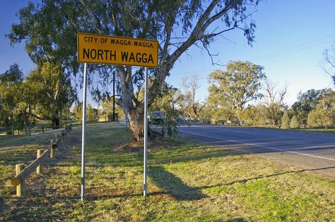 Wagga Wagga is a city on the Murrumbidgee River in NSW The term "Wagga" in the Wiradjuri Aboriginal language is thought to mean crow. To create the plural, the Wiradjuri repeat a word, thus 'Wagga Wagga' translates to 'the place of many crows'. It's OK to call Wagga Wagga just 'Wagga', but it's not ok to do the same with Woy Woy or Bong Bong. Aboriginal Language, Bong Bong, Aussie Girl, Wagga Wagga, Sign Post, Nsw Australia, Island Home, Road Signs, Place Names