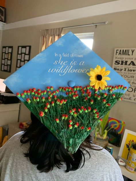 Grad Cap Ideas Agriculture, Nana Graduation Cap, Noah Kahan Grad Cap Ideas, Cool Cap Ideas, Wildflower Graduation Cap, Folklore Graduation Cap, Garden Graduation Cap, Grad Cap With Bangs, Graduation Cap Flower Designs